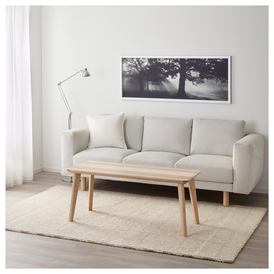IKEA Lindelse rug in natural beige colour with grey sofa behind
