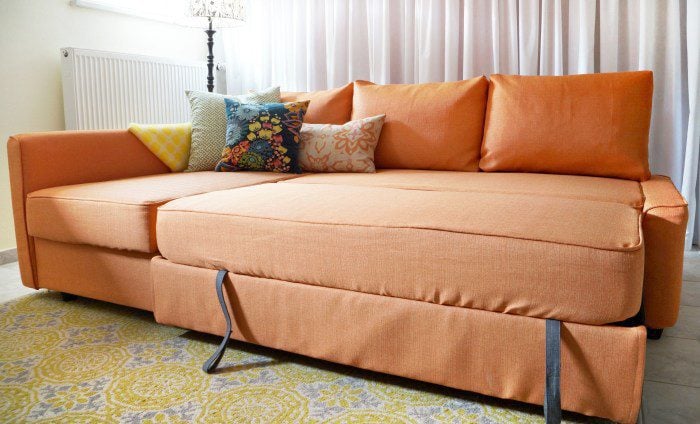 An IKEA friheten sofabed with pulled out trundle bed
