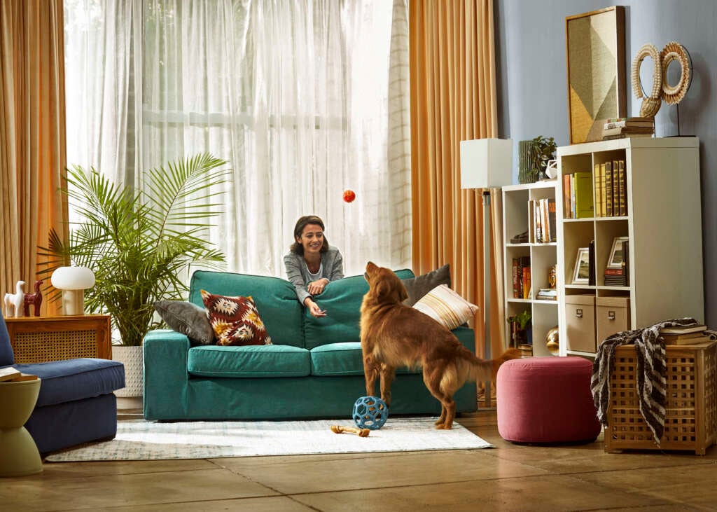 Lady with dog in living room