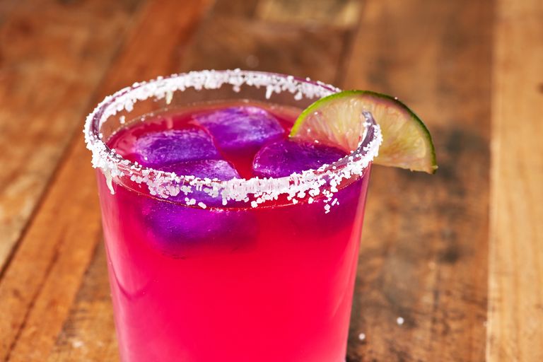 Colour-changing margarita made of red cabbage ice cubes