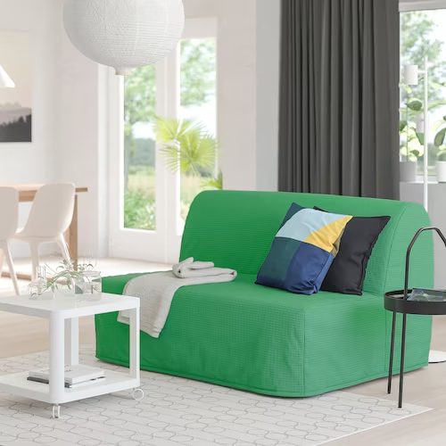 Bright green sofa bed in living room