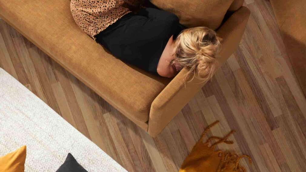woman-laying-on-sofa
